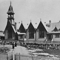 Pupils and teachers outside Mount Cook Infant School, Wellington, 1875