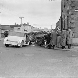 Scene of an accident between a truck and car at the corner of Tasman and Buckle Streets, Wellington, 24 July 1950.