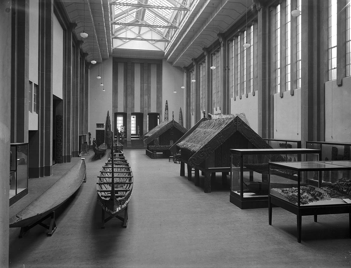 Maori artifacts, particularly waka (canoes) and pataka (storehouses), inside the Maori Hall at the Dominion Museum, Buckle Street, Wellington, c.1936